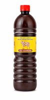 Herbal gomutra bottle with red cap, dark brown body, and yellow label with cattle graphic