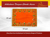 Orange velvet pooja aasan cloth with gold trim and green motifs along the outer edge