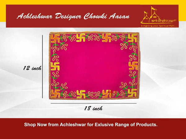 Square pink pooja asan with golden border and green-gold embroidered decorative scrolls.