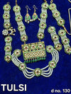 Festival goddess jewellery set with green enamel earrings, layered pearl necklace, and pendant