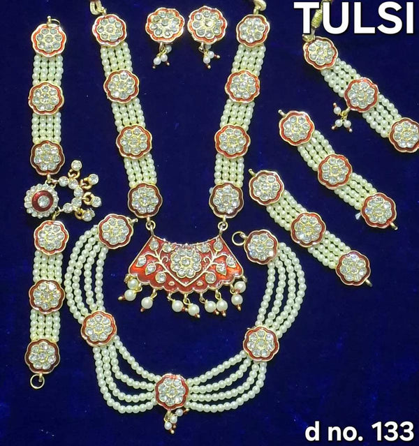Temple shringar jewellery set with pearl bead necklaces and red-green kundan pendants