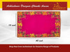 Pink velvet pooja asan with golden border and green-gold embroidered corner motifs.