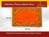Orange velvet pooja aasan cloth with gold and green embroidered detailing around corners