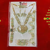 Gold-toned kundan jewellery set on card: pendant necklace, matching earrings, bangles