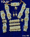 Kundan ornament jewelry set with layered choker, drop earrings, and stacked bangles