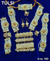 Kundan ornament jewelry set with choker, dangling earrings, and bangles