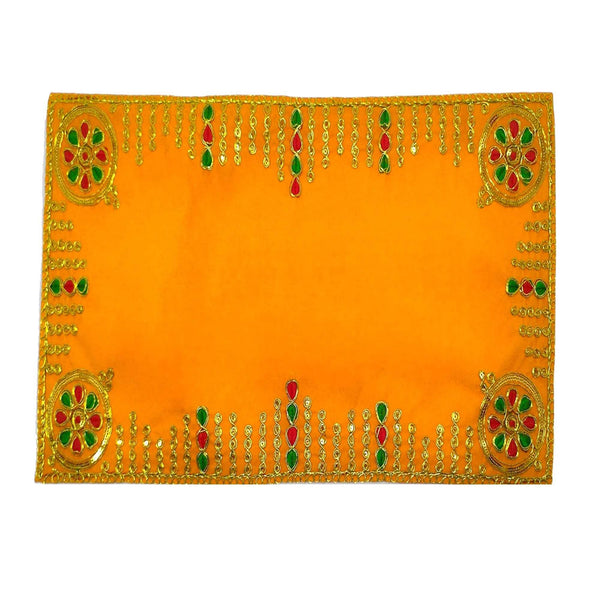 Yellow velvet pooja aasan cloth with dense golden beadwork border and corner medallions