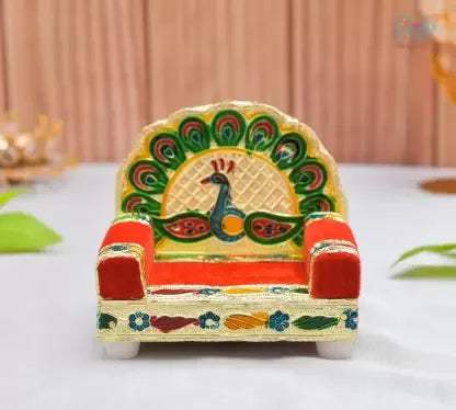 Wooden singhasan with painted peacock motif and scalloped arched back, colorful accents