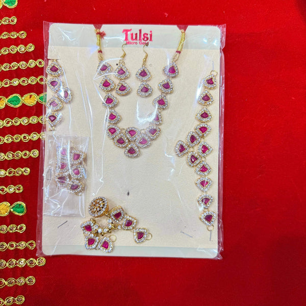 Jewellery shringar set in box on display card, gold-tone kundan with red teardrop stones