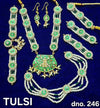 Traditional shringar set with green stone drops and pearl chains; necklace, earrings, tikka