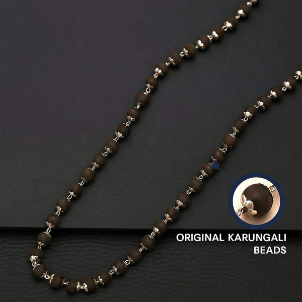 Bead mala necklace with dark beads and small silver flower spacers, long strand