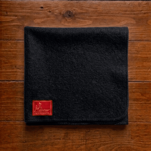 Black woolen square meditation mat with red label patch and stitched border