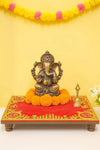 Red embroidered velvet pooja aasan cloth with golden border and floral corner motifs