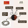 Bead mala necklace with dark round beads and silver accents, close-up of strand
