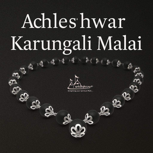 Bead mala necklace with dark beads and silver flower caps, symmetrical circular layout