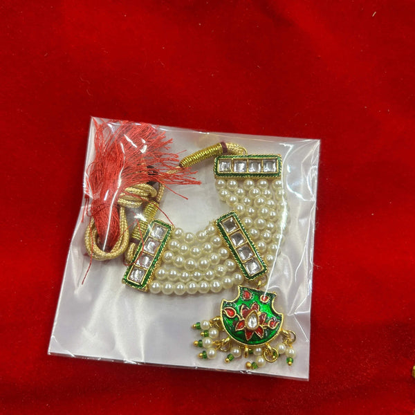 Gold and pearl bead garland necklace with green jeweled pendant
