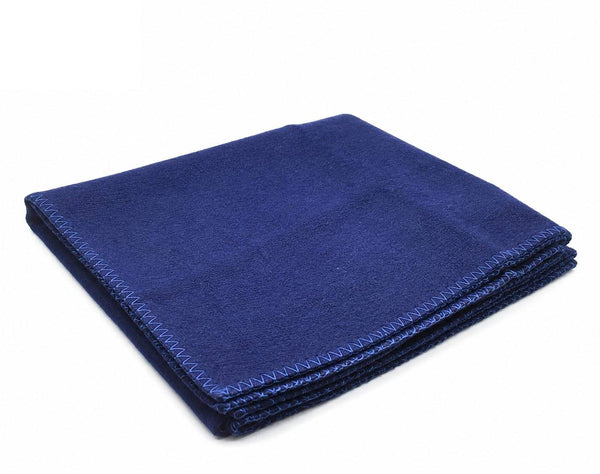 Blue wool meditation mat, neatly folded with stitched edge along the border