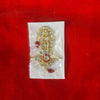 Gold rhinestone idol kilangi ornament with red bead drops on clear backing
