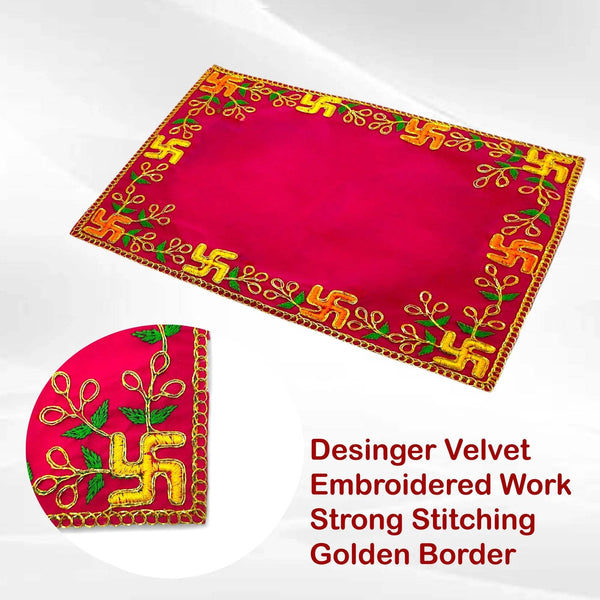 Pink velvet pooja asan with golden border and green-gold embroidered work.