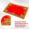 Red pooja aasan cloth with golden embroidered border and four jewel-like corner designs