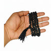 Black tulsi bead mala in hand with short tassel end and bead strand