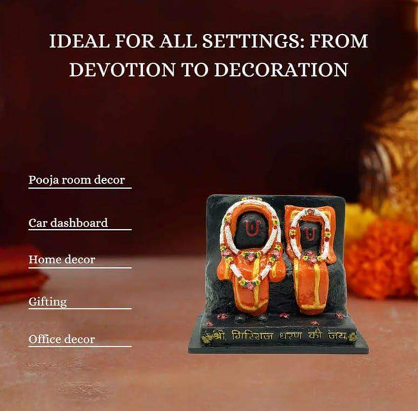 Marble dust idol statue with two seated figures in white and gold accents on black base