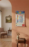Framed wall calendar with colorful monthly date grid and border
