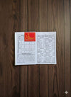 Open astrology jantri rashifal book pages with printed tables and Hindi text