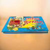 Garuda Purana book with blue cover, illustrated figures, and red Devanagari title