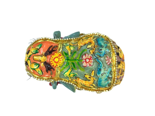 Handmade elephant statue with colorful painted embossed body and decorative trim