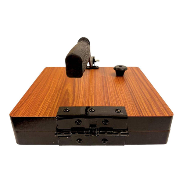 Front view of wooden roti press with black hinge bar and lever handle assembly.