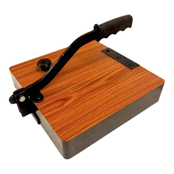 Square roti press machine with wooden base, black handle, and metal plate detail.