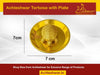Gold brass tortoise ornament centered on round plate