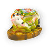 Decorative cow and calf figurine with jeweled multicolor cloth on a brown base