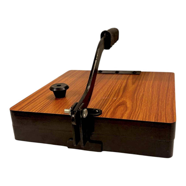 Square wooden roti press with upright black handle, round knob, and metal mount.