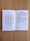 Open Hindi tantra book with printed diagram and columns of text