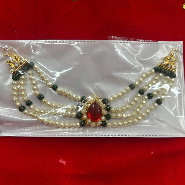 Beaded garland decoration with red teardrop centerpiece, pearl strands, and green accents