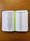 Open spiritual book with two columns of text and a green ribbon bookmark