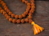 8mm 5 Mukhi rudraksha mala with dark brown beads and orange tassel
