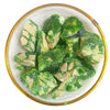 Green loban dhoop resin pieces on a small plate