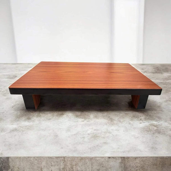 Wooden pooja chowki on four legs, rectangular top with wood grain