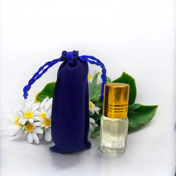 Blue drawstring pouch and small gold-capped glass attar bottle with clear liquid