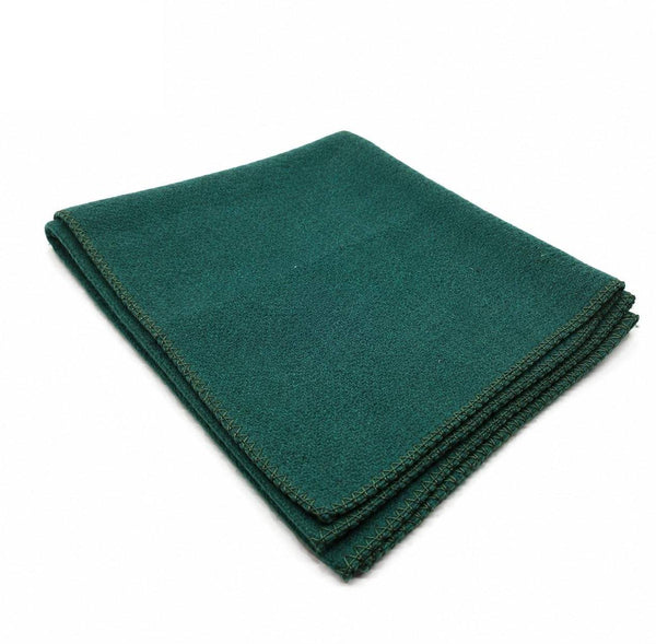 Green wool meditation mat, neatly folded with neat stitched border