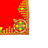 Red velvet pooja aasan corner with gold embroidery, dotted edging, and circular medallion