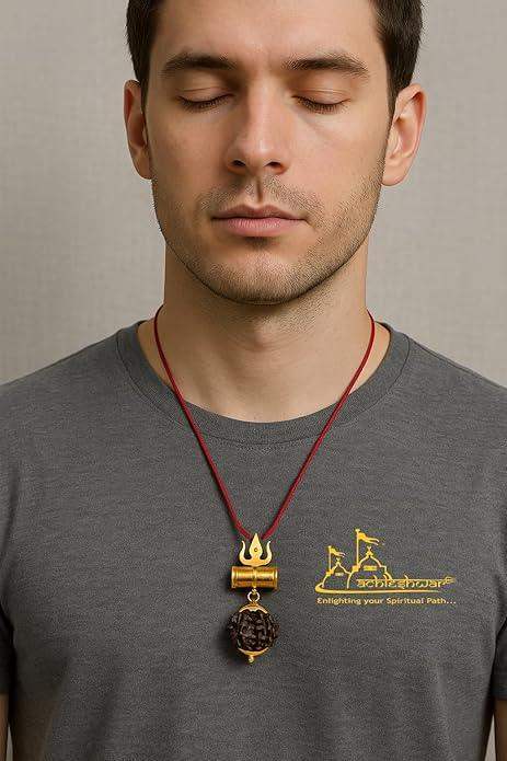 Gold trident pendant with dark rudraksha bead on red cord necklace