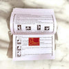 Printed religious booklet pages with paragraphs, small icons, and red devotional emblem