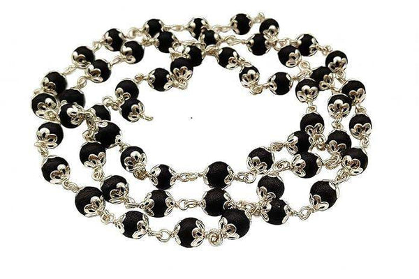 Wood mala necklace with black round beads and silver-toned floral connectors