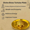 Gold brass tortoise on round plate with raised shell design