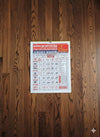 Hindu panchang calendar page on wall with multicolor date grid and festival details