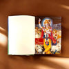 Open spiritual book showing printed pages and devotional illustration on the right